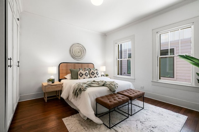 4536 Duval St Unit 2, Austin, TX 78751 - bedroom with crown molding, baseboards, and dark wood-style flooring