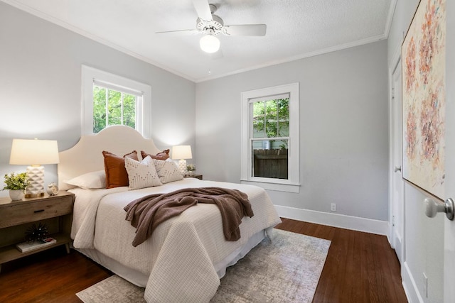 4536 Duval St Unit 2, Austin, TX 78751 - bedroom featuring crown molding, wood finished floors, baseboards, and ceiling fan