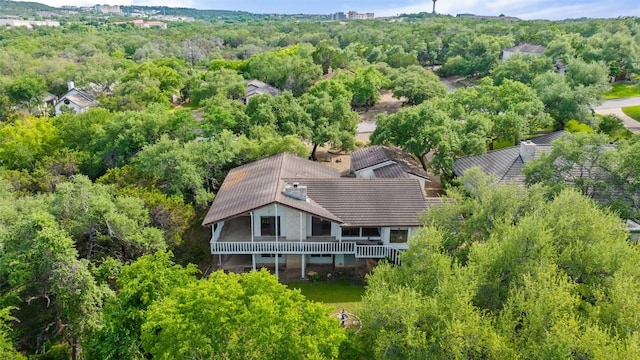 view of subject property featuring a forest