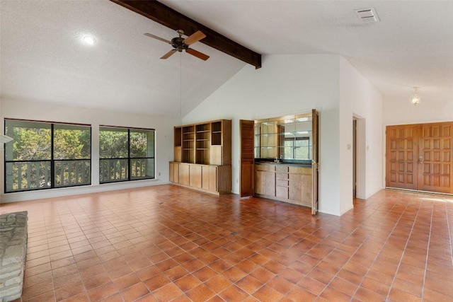unfurnished living room with beamed ceiling, a ceiling fan, tile patterned flooring, recessed lighting, and high vaulted ceiling