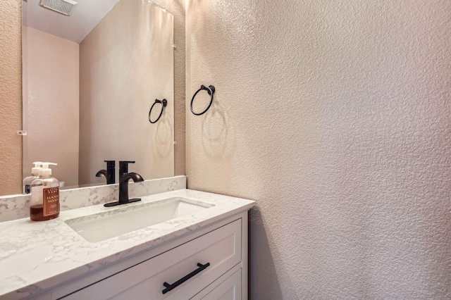 10517 S Canoa Hills Trl, Austin, TX 78717 - bathroom with vanity and a textured wall