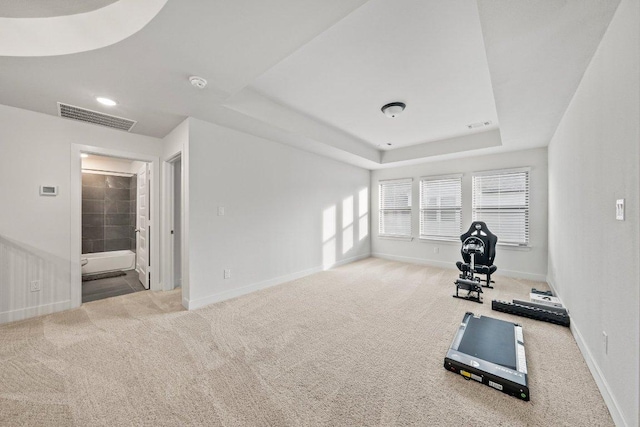 124 Low River Ln, Georgetown, TX 78628 - workout area with baseboards, carpet flooring, and a raised ceiling