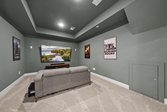 124 Low River Ln, Georgetown, TX 78628 - home theater with light colored carpet, baseboards, a tray ceiling, and recessed lighting