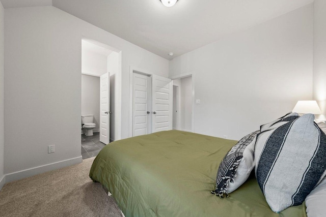 124 Low River Ln, Georgetown, TX 78628 - bedroom with connected bathroom, carpet, and baseboards