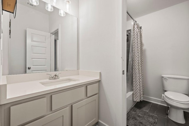 124 Low River Ln, Georgetown, TX 78628 - bathroom with toilet, baseboards, vanity, tile patterned flooring, and shower / bathtub combination with curtain
