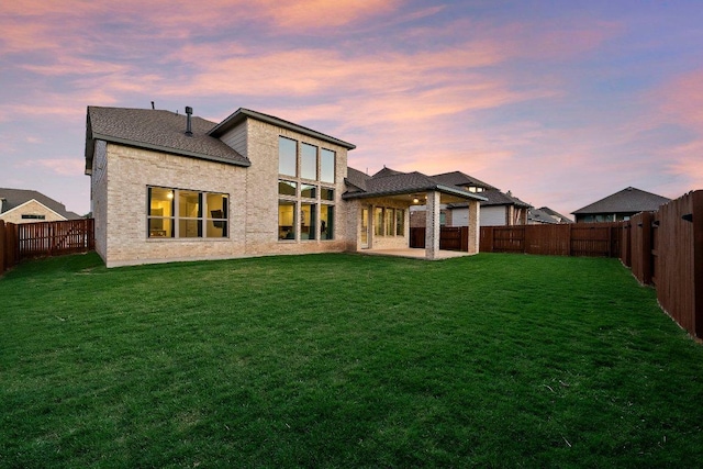 124 Low River Ln, Georgetown, TX 78628 - rear view of house with a patio