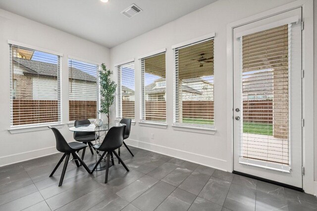 124 Low River Ln, Georgetown, TX 78628 - dining area with baseboards and dark tile patterned floors