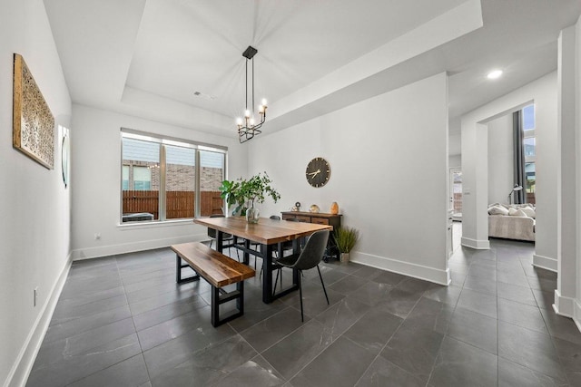 124 Low River Ln, Georgetown, TX 78628 - dining room featuring a chandelier, baseboards, a tray ceiling, and recessed lighting