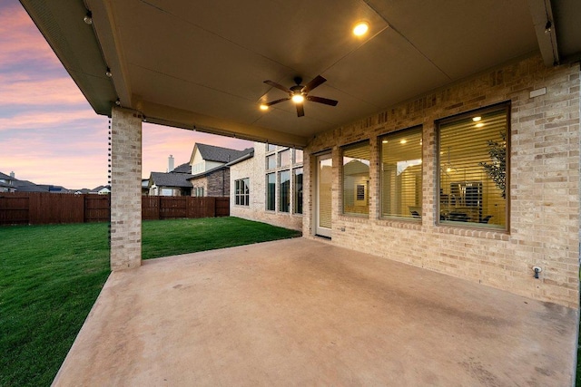 124 Low River Ln, Georgetown, TX 78628 - patio terrace at dusk featuring ceiling fan