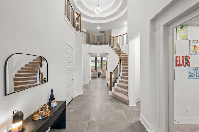 124 Low River Ln, Georgetown, TX 78628 - entrance foyer featuring stairs, baseboards, and a towering ceiling