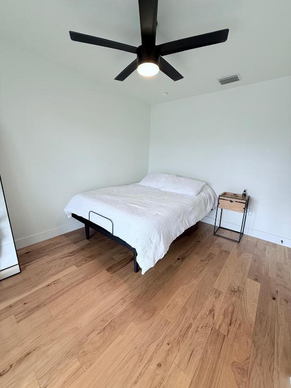 806 Philco Dr Unit 2, Austin, TX 78745 - bedroom featuring light wood-type flooring, baseboards, and a ceiling fan