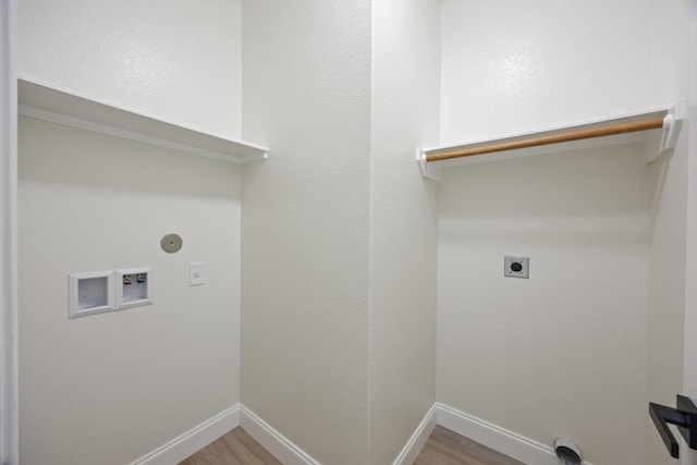13221 Cabinet Dr, Manor, TX 78653 - laundry room with electric dryer hookup, washer hookup, and light wood-type flooring