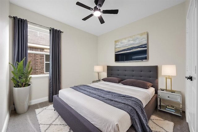 carpeted bedroom with baseboards and a ceiling fan