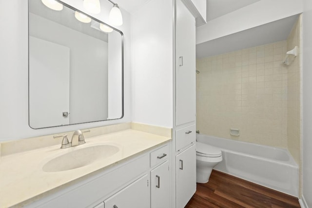 12025 Wycliff Ln, Austin, TX 78727 - full bathroom featuring vanity, wood finished floors, and bathing tub / shower combination