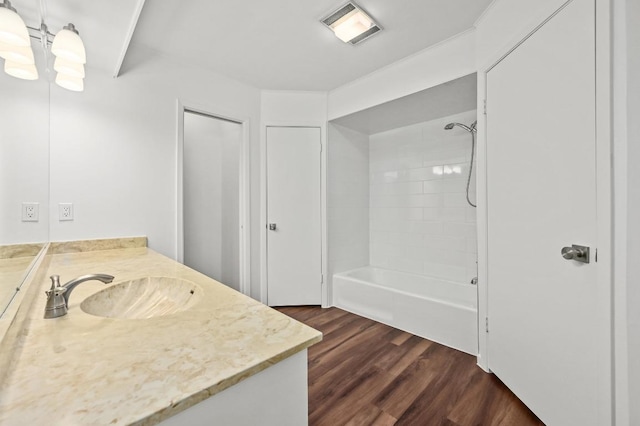12025 Wycliff Ln, Austin, TX 78727 - bathroom featuring vanity, wood finished floors,  shower combination, and a chandelier