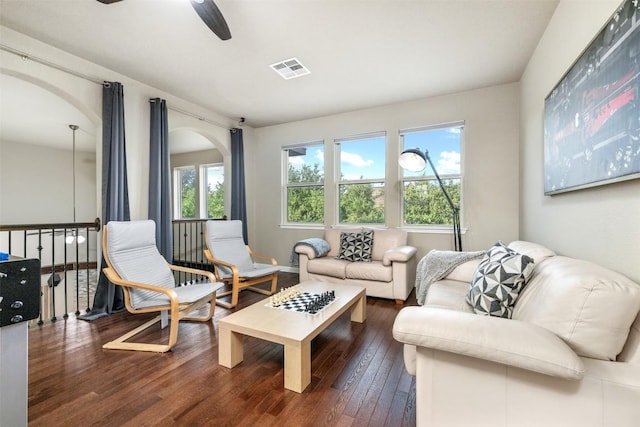 402 Dry Gulch Bnd, Cedar Park, TX 78613 - living area with arched walkways, hardwood / wood-style floors, and a ceiling fan