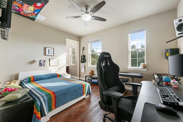 402 Dry Gulch Bnd, Cedar Park, TX 78613 - bedroom with hardwood / wood-style floors, a desk, baseboards, and a ceiling fan