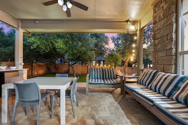 402 Dry Gulch Bnd, Cedar Park, TX 78613 - patio terrace at dusk with a fenced backyard, ceiling fan, a patio area, an outdoor hangout area, and outdoor dining area