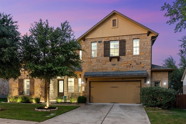 402 Dry Gulch Bnd, Cedar Park, TX 78613 - view of front facade with stone siding, a garage, concrete driveway, and stucco siding