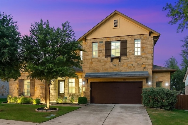 402 Dry Gulch Bnd, Cedar Park, TX 78613 - view of front of house featuring stone siding, an attached garage, concrete driveway, and stucco siding