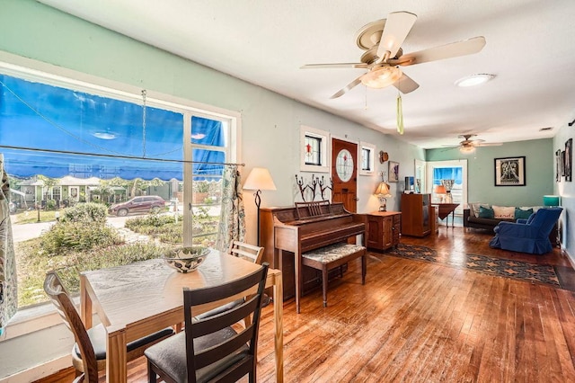 dining room featuring ceiling fan and hardwood / wood-style floors