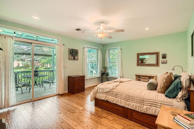 bedroom featuring access to exterior, wood finished floors, a ceiling fan, baseboards, and recessed lighting