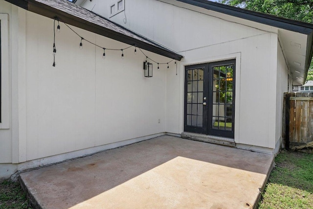 property entrance with french doors, a patio area, and fence