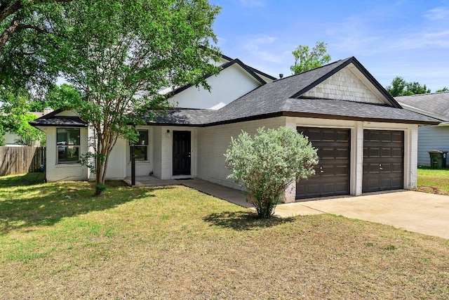 single story home with a garage, concrete driveway, brick siding, and a shingled roof