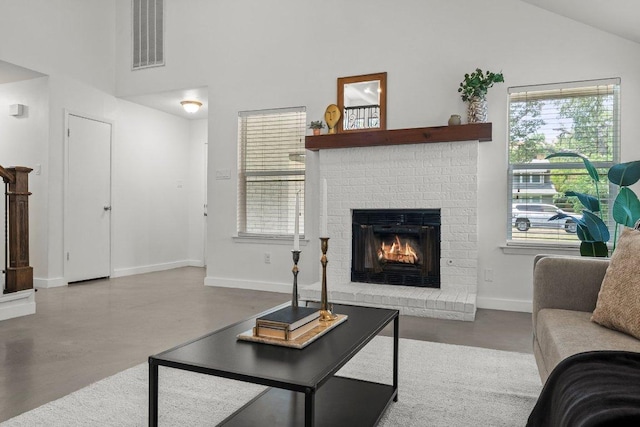 11701 Tanglebriar Trl, Austin, TX 78750 - living room with finished concrete flooring, a fireplace, healthy amount of natural light, and high vaulted ceiling