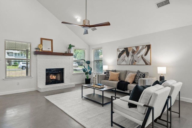 11701 Tanglebriar Trl, Austin, TX 78750 - living room featuring high vaulted ceiling, ceiling fan, concrete floors, and a brick fireplace
