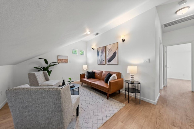 11701 Tanglebriar Trl, Austin, TX 78750 - living room featuring light wood-style floors and lofted ceiling