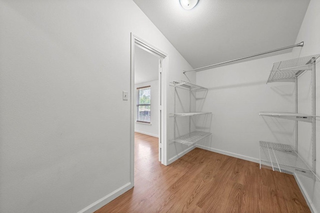 spacious closet with light wood finished floors