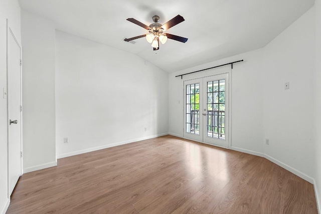 11701 Tanglebriar Trl, Austin, TX 78750 - unfurnished room featuring a ceiling fan, lofted ceiling, and wood finished floors