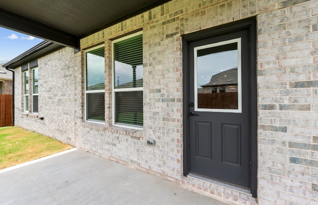 13404 Lapoynor St, Manor, TX 78653 - property entrance featuring brick siding
