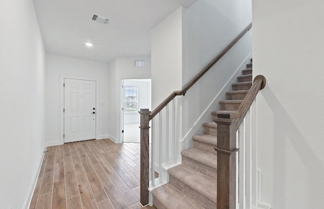 13404 Lapoynor St, Manor, TX 78653 - entrance foyer with light wood-style flooring, stairway, and recessed lighting