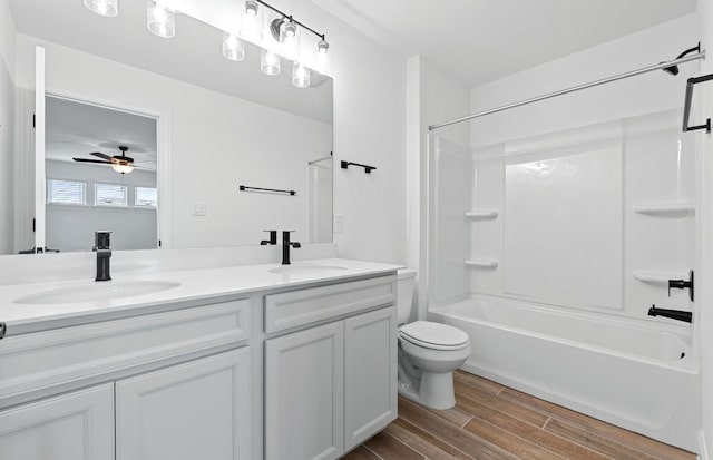 13404 Lapoynor St, Manor, TX 78653 - bathroom with double vanity, wood finished floors, bathing tub / shower combination, and ceiling fan