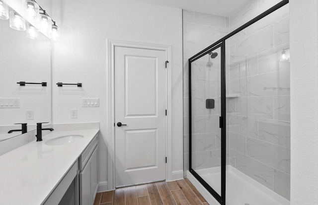 13404 Lapoynor St, Manor, TX 78653 - full bath with vanity, a stall shower, and wood finished floors
