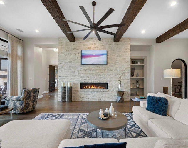 2510 Belaire E Ln, Granite Shoals, TX 78654 - living area with wood finished floors, beamed ceiling, ceiling fan, a fireplace, and baseboards