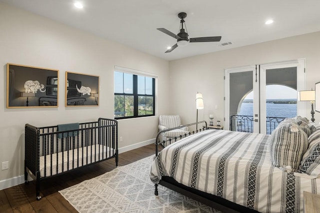 2510 Belaire E Ln, Granite Shoals, TX 78654 - bedroom featuring wood finished floors, recessed lighting, baseboards, a water view, and access to outside