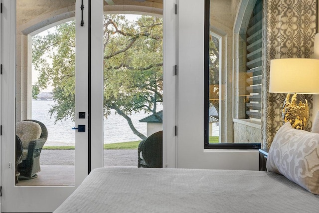 2510 Belaire E Ln, Granite Shoals, TX 78654 - bedroom featuring a water view, access to outside, and multiple windows