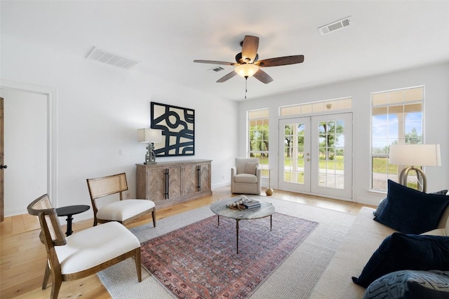 700 Longview Cir, Dripping Springs, TX 78620 - living area with ceiling fan, french doors, and wood finished floors
