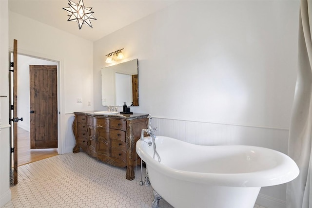 700 Longview Cir, Dripping Springs, TX 78620 - full bathroom featuring wainscoting, a freestanding tub, and vanity