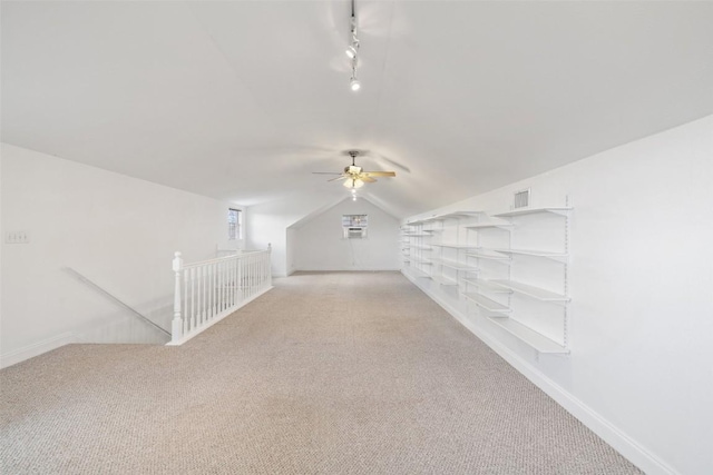 700 Longview Cir, Dripping Springs, TX 78620 - bonus room featuring light carpet, lofted ceiling, a ceiling fan, and baseboards
