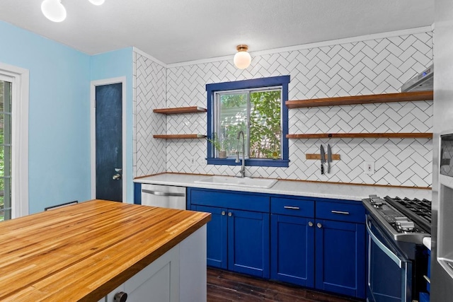 5105 Stone Gate Dr, Austin, TX 78721 - kitchen featuring open shelves, stainless steel appliances, wood counters, blue cabinets, and a sink