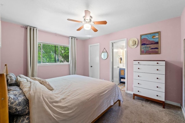 5105 Stone Gate Dr, Austin, TX 78721 - carpeted bedroom with ensuite bathroom and a ceiling fan