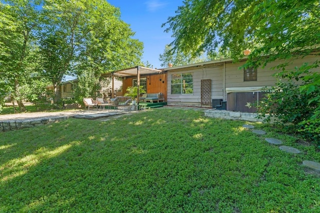 5105 Stone Gate Dr, Austin, TX 78721 - rear view of house featuring a patio and a yard
