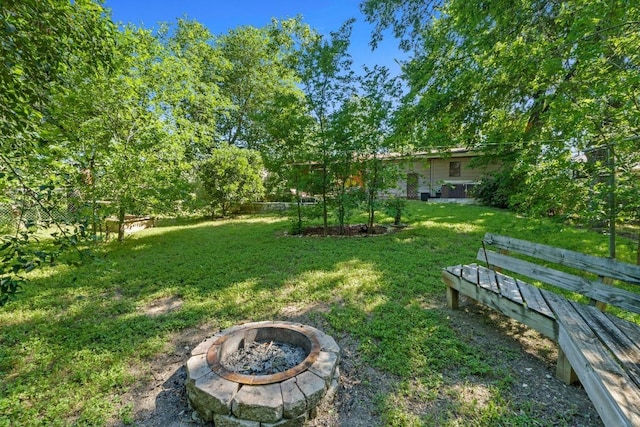 5105 Stone Gate Dr, Austin, TX 78721 - view of grassy yard featuring a fire pit