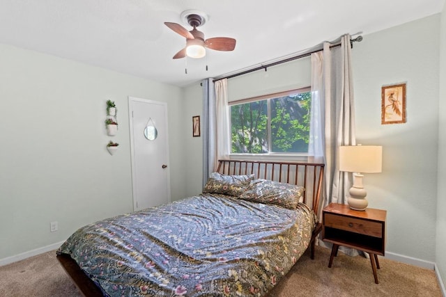 5105 Stone Gate Dr, Austin, TX 78721 - carpeted bedroom with baseboards and ceiling fan