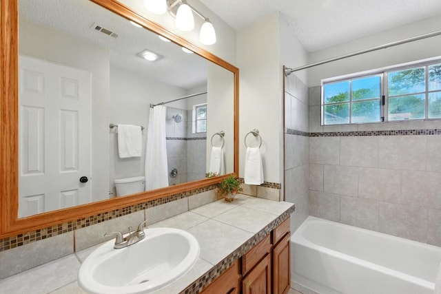 full bathroom with shower / bath combo, toilet, and vanity