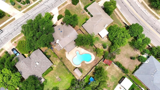 aerial view of residential area with a pool area
